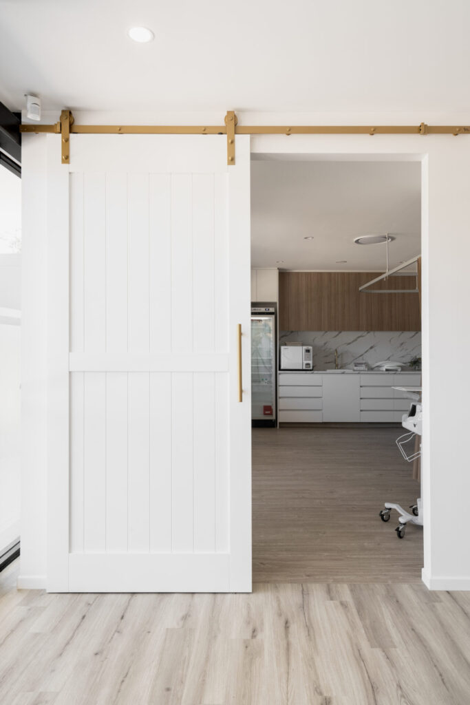 Functional medical rooms, hardwood floors and welcoming reception area for this medical shop fit out for Plaza Central