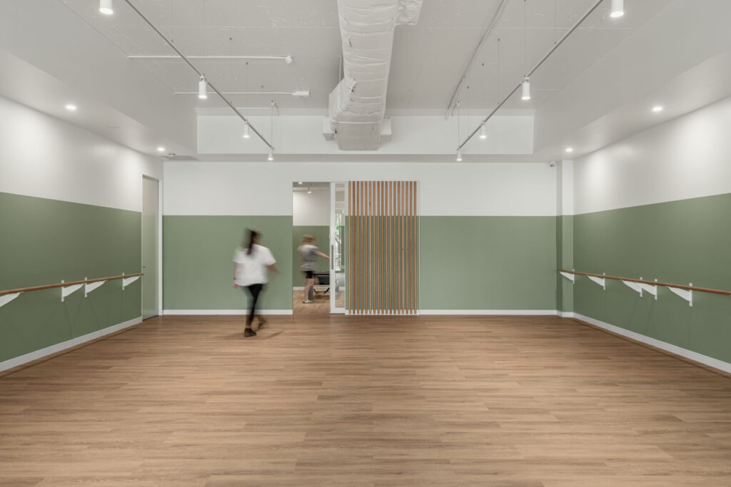 Pilates reformers, hardwood floors and welcoming reception area for this fitness fit out for Premium Pilates