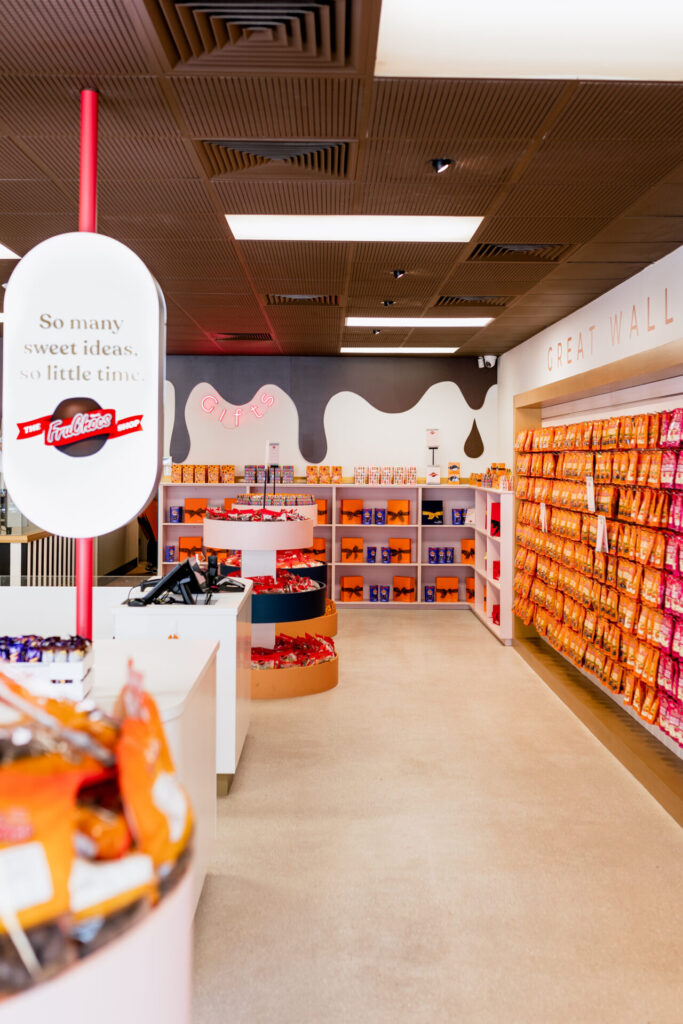 Custom ceiling drip pattern, custom LED signage and bespoke merchandise displays for this retail fit out for Fru Choc