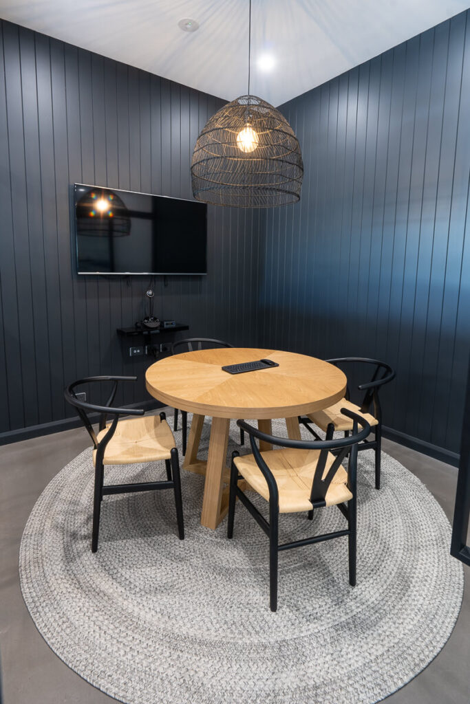 VJ panel walls, pendant lighting and welcoming reception area for this office fit out for McGrath