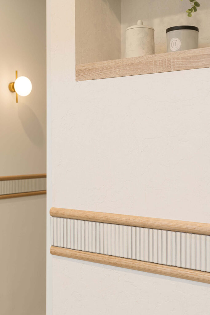 Bespoke curved wall features, elegant lights and green toned colour palette for this wellness & beauty fit out for Skin and Body Club